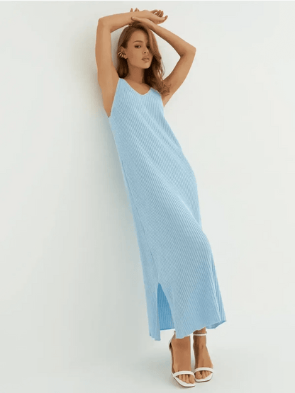 Model in a sleeveless ribbed knit azure blue maxi dress showcasing effortless elegance.