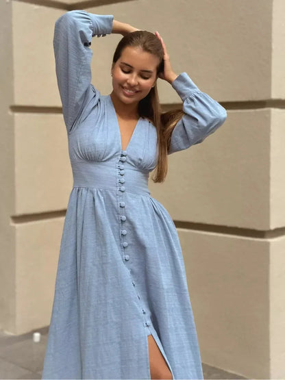 Azure Grace Maxi Dress in light blue, featuring button detail, cinched waist, and flowy silhouette.
