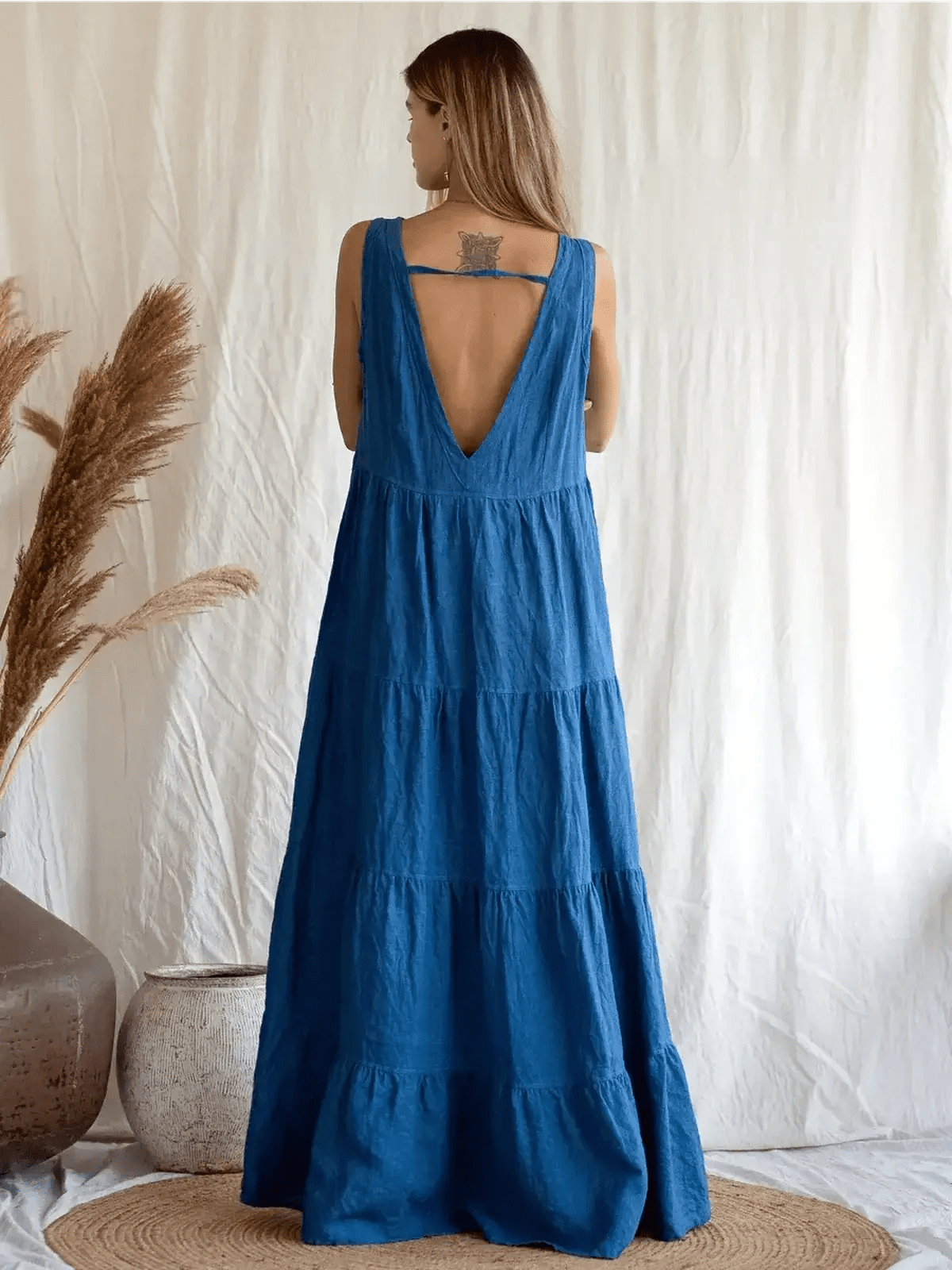 Azure Grace Maxi Dress in deep blue, showcasing a sleeveless design and elegant open back detail.