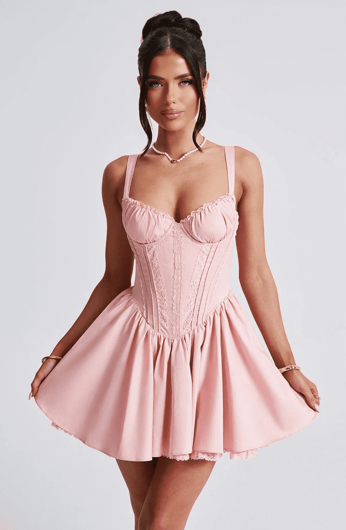 Pink Barbie mini dress with corset design and voluminous skirt, perfect for summer parties and special occasions.