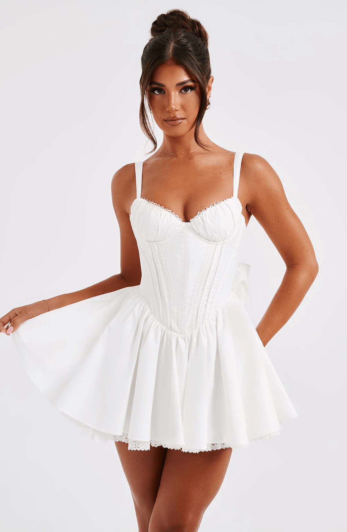 White Barbie Mini Dress featuring a corset bodice and voluminous skirt, perfect for summer dresses and wedding guest attire.