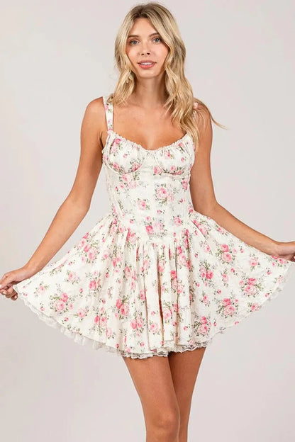 Barbie Mini Dress with floral pattern, corset bodice, and flared skirt, ideal for summer and party occasions.