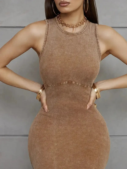 Close-up of a woman in a sleeveless, sculpted brown maxi dress, showcasing its ribbed texture and elegant fit.