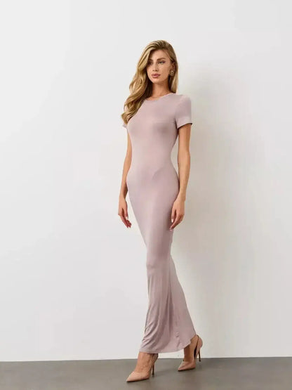 Bare Essence Maxi Dress by Lauven features a neutral beige tone, U-neckline, and curve-hugging silhouette.