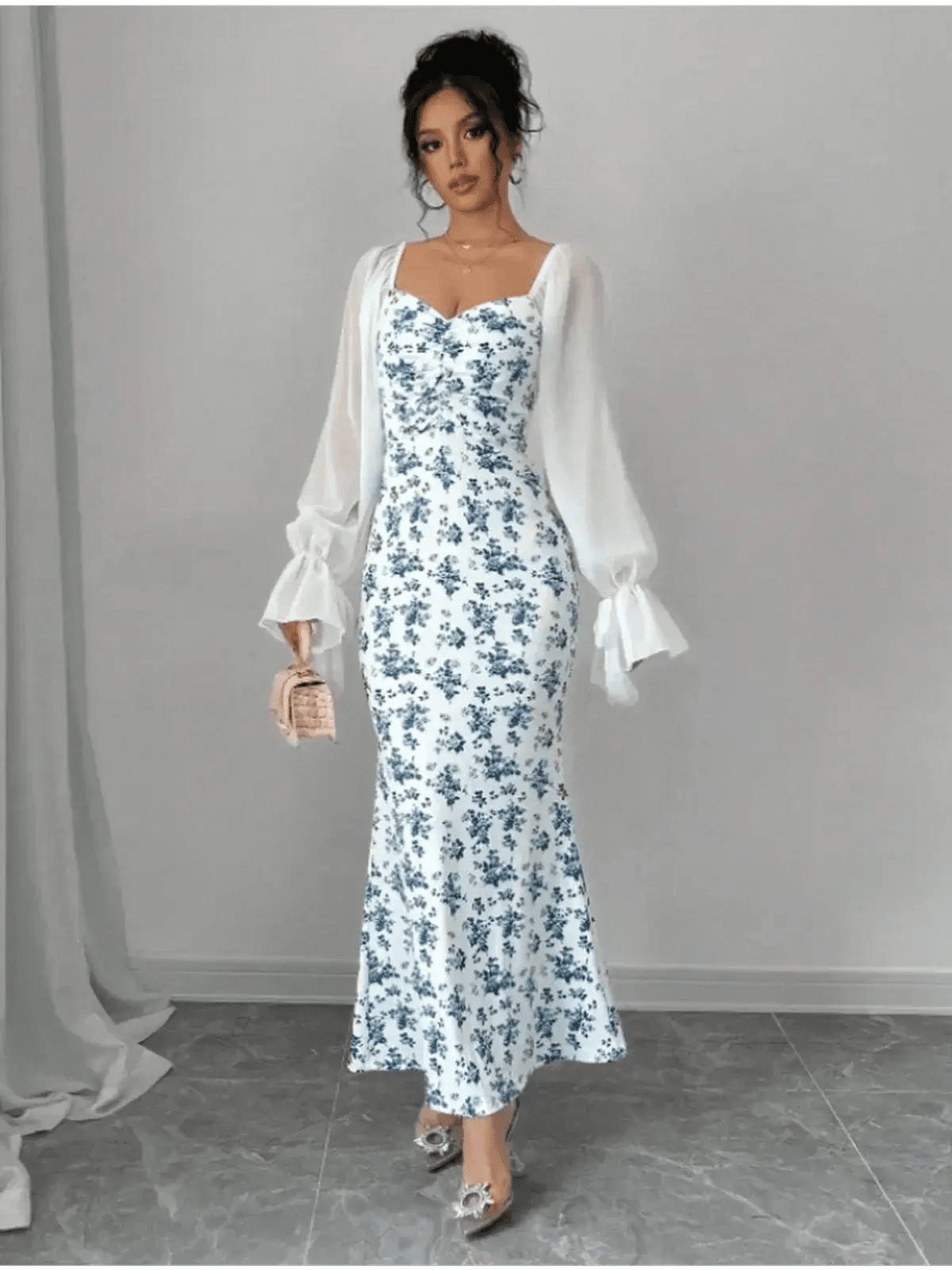 Bluebelle Maxi Dress with floral pattern and sheer sleeves, perfect for elegant occasions and timeless femininity.
