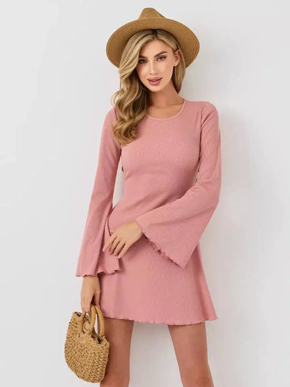 Blush Aura mini dress by Lauven, featuring a pink A-line silhouette with flared sleeves and a U-neckline.