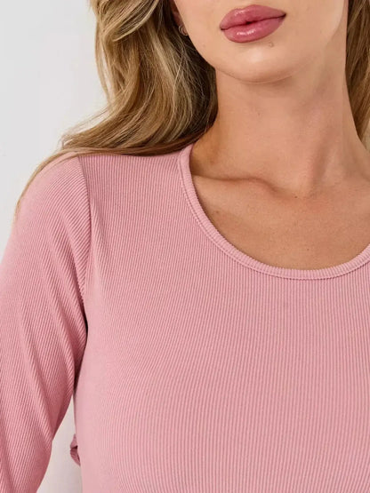 Close-up of the scoop neckline and textured fabric of the Blush Flare mini dress by Lauven, showcasing soft elegance.