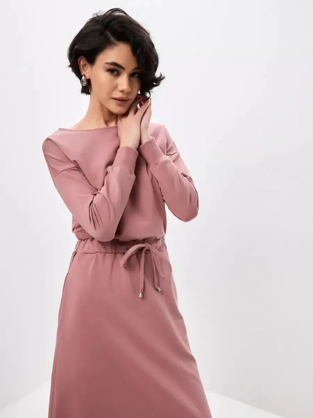Model showcasing the Blush Lounge Maxi Dress in dusty pink, featuring a boat neckline and adjustable drawstring waist.