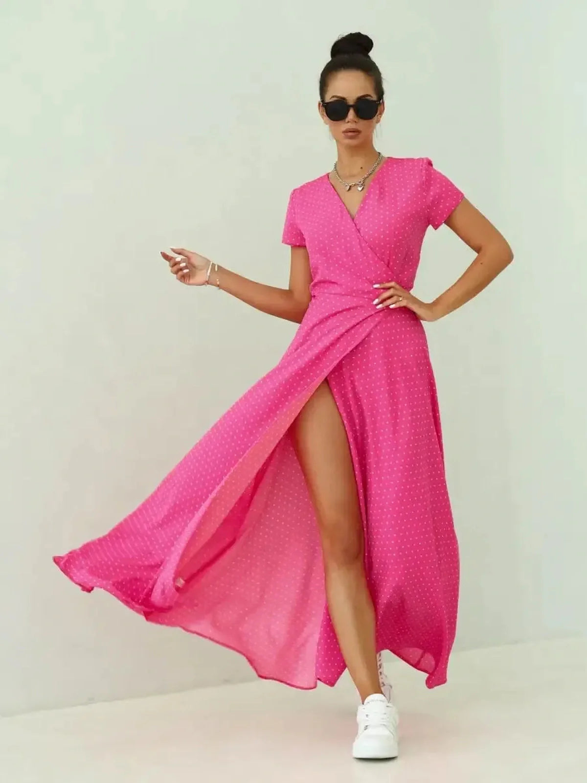 Feminine Blush Radiance Maxi Dress in vibrant pink polka dots with airy sleeves and stylish slit.