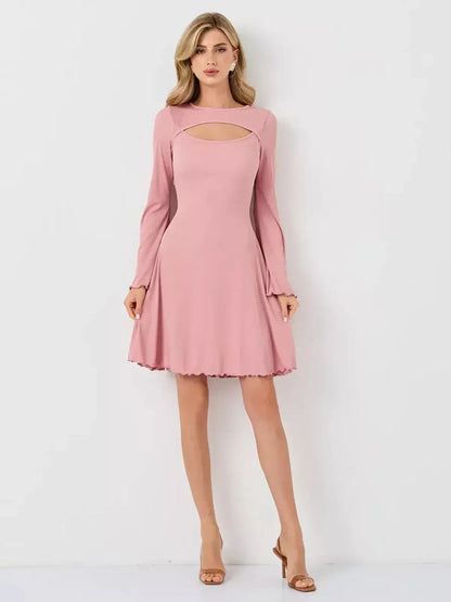 Blush Whisper dress by Lauven, showcasing a pink ribbed knit design with flattering U-neckline and flared sleeves.