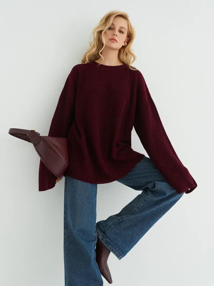 Bordeaux Sweater by Lauven in deep burgundy, oversized knit with wide sleeves, paired with denim jeans.