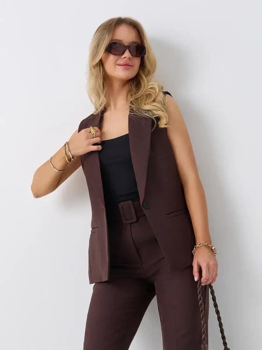 Stylish woman wearing Cacao Suit Set by Lauven with sleeveless vest and high-waist pants, exuding modern elegance.