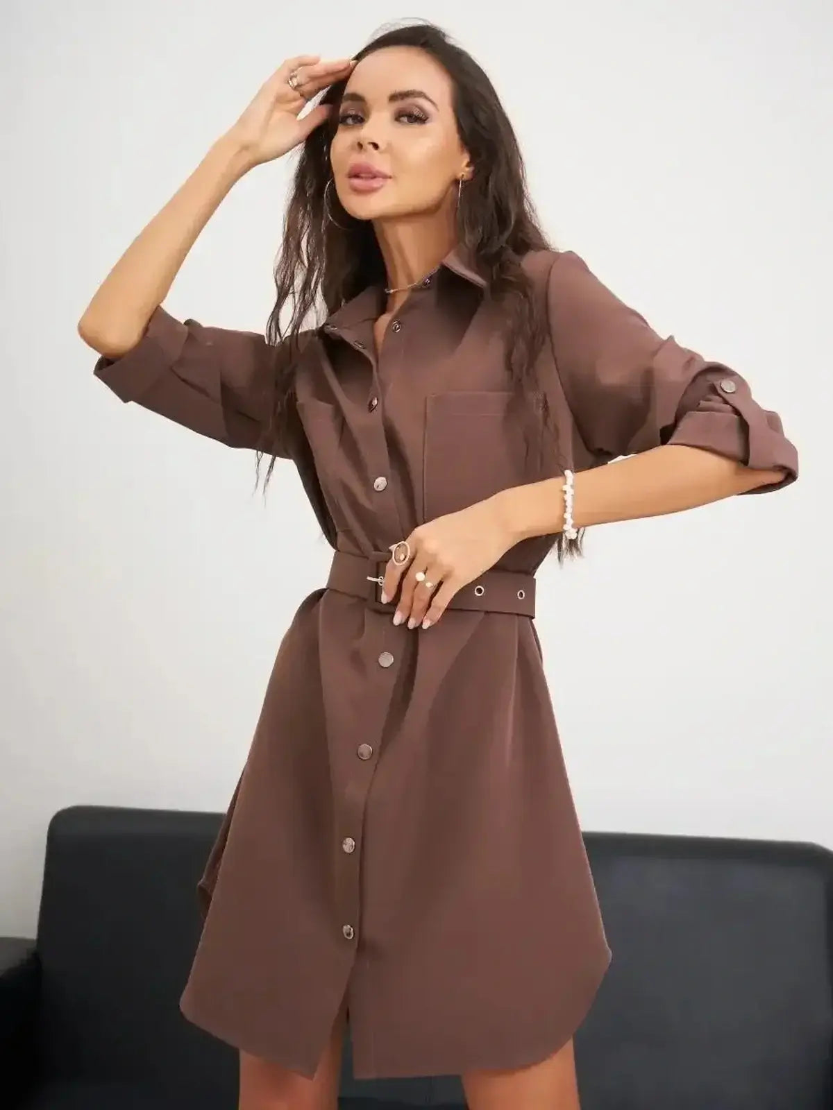 Chic brown mini dress with button-down front and relaxed fit, perfect for summer and versatile for various occasions.