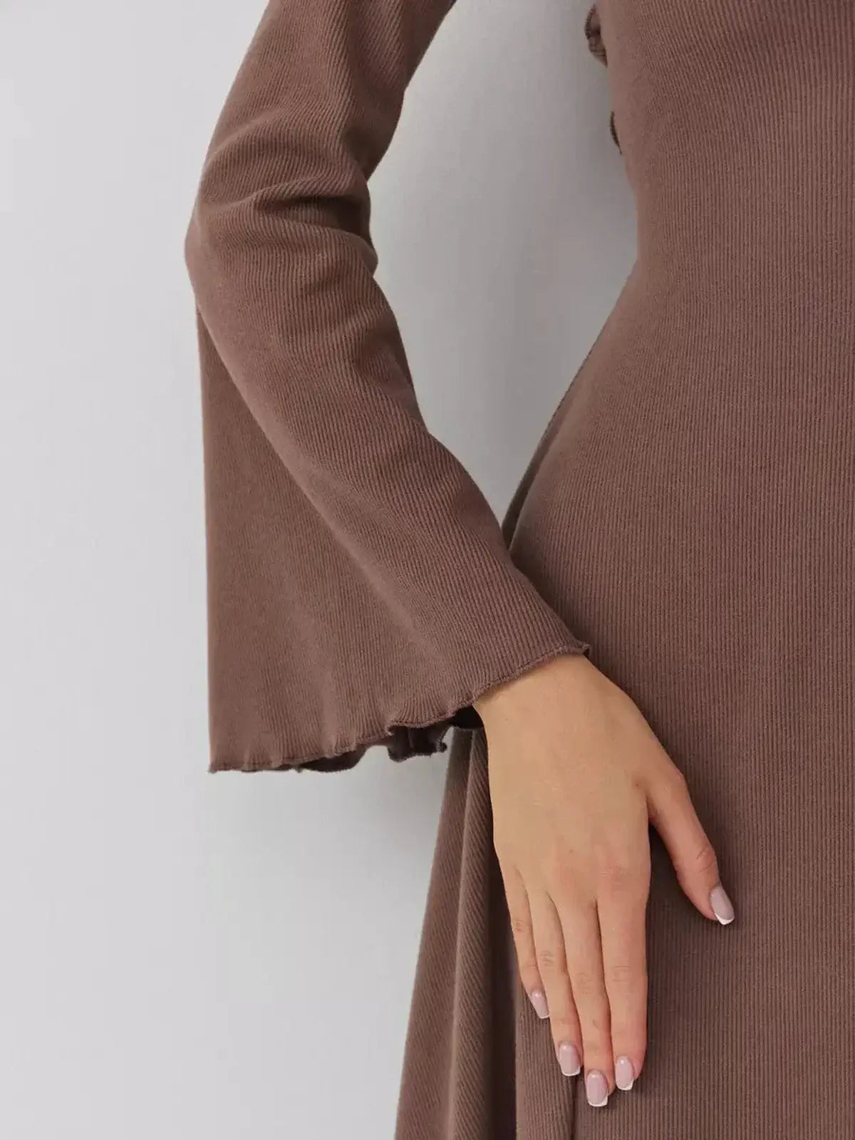 Close-up of the flared cuff and ribbed texture of the Lauven Café Flare mini dress in rich coffee hue.