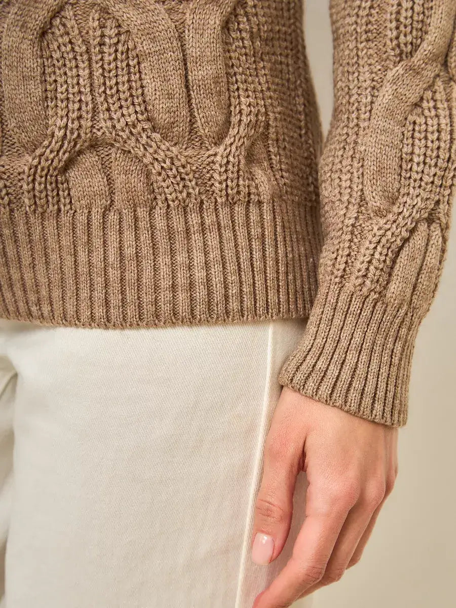 Cappuccino Knitwear by Lauven, showcasing the textured detail and cozy fit of an oversized turtleneck sweater.