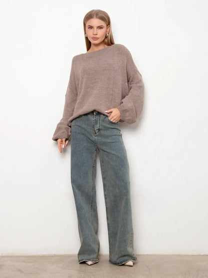 Oversized women wearing the Cappuccino Sweater by Lauven, featuring a boat neck and cozy knit design.