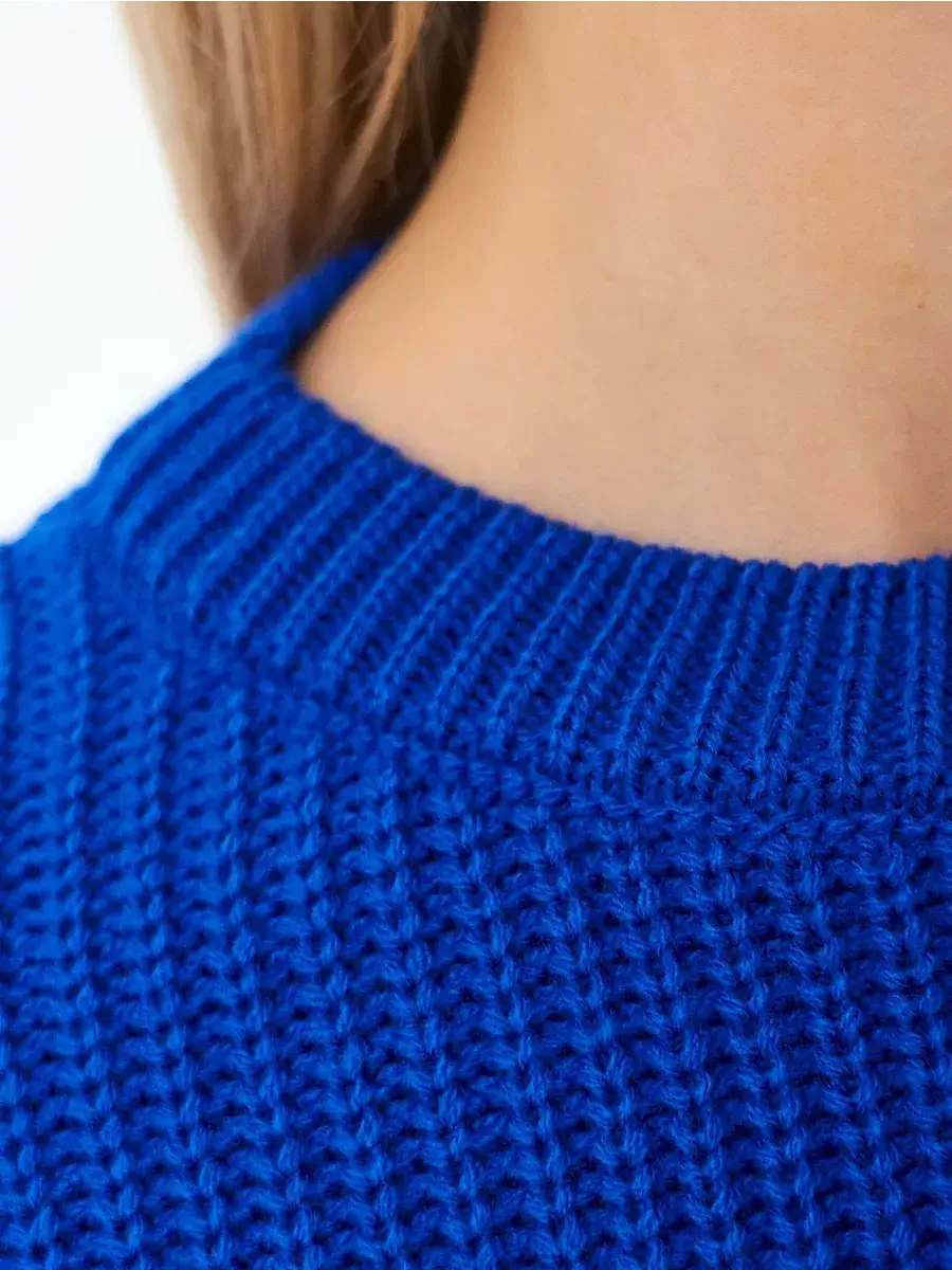 Close-up of the neckline of the Capri Sweater by Lauven in vibrant electric blue oversized knit.