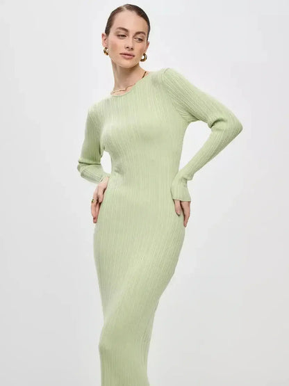 Celery Luxe Maxi Dress by Lauven showcasing a light green ribbed-knit silhouette in a sophisticated pose.