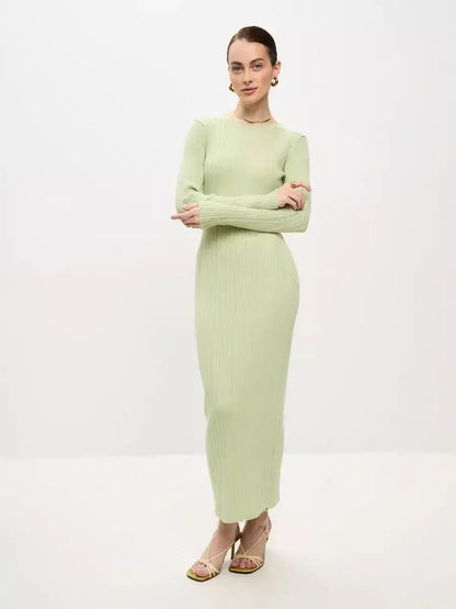 Celery Luxe Maxi Dress by Lauven, showcasing a light green ribbed silhouette with long sleeves and a seamless fit.
