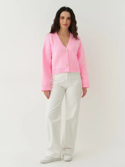 Celeste Cardigan by Lauven, cropped pink knit with heart buttons, perfect for casual or polished looks.