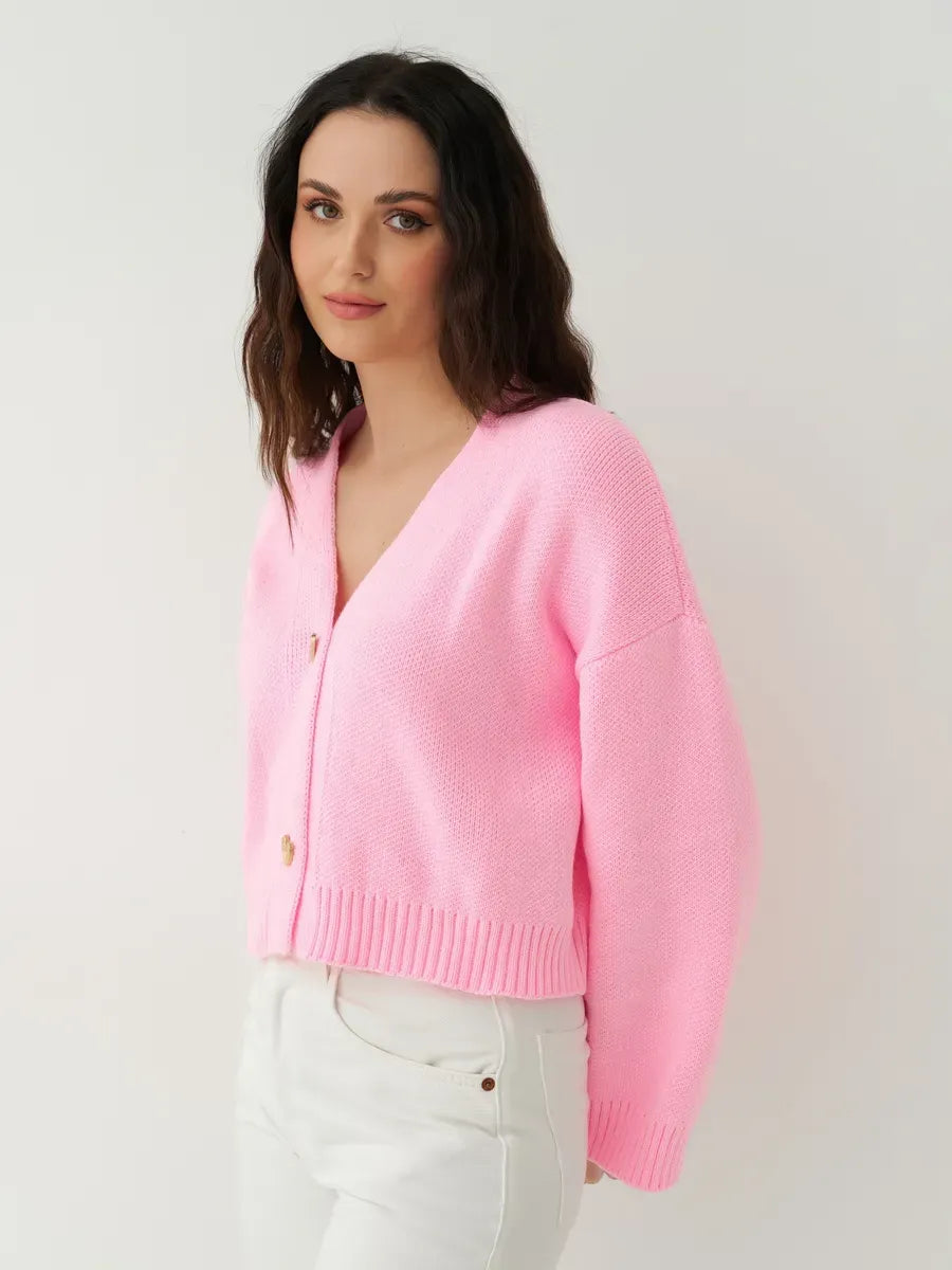 Celeste Cardigan by Lauven in vibrant pink, featuring heart buttons and a cropped knit design for a feminine touch.