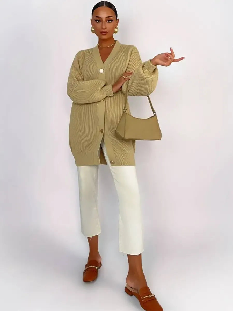 Celeste Cardigan by Lauven - Longline oversized knit cardigan in warm beige, styled with white pants.