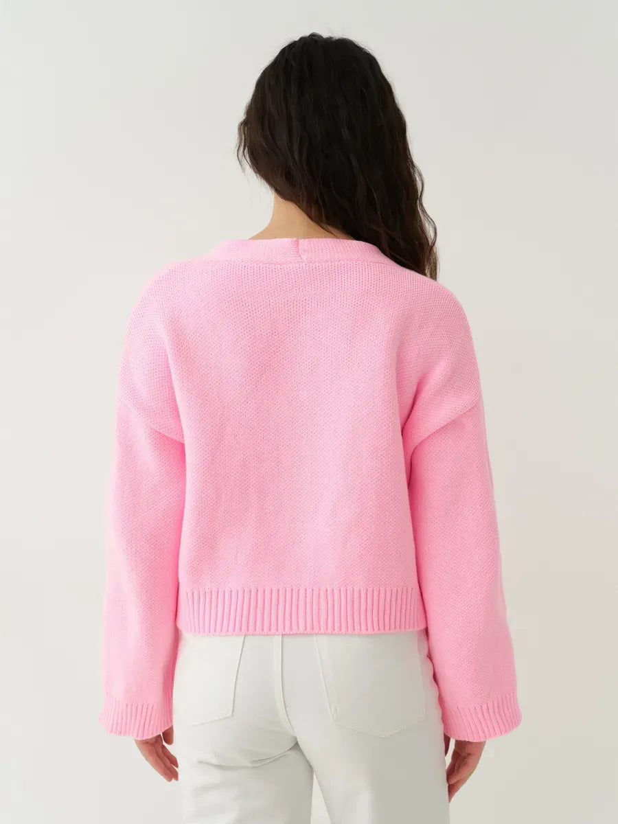 Celeste Cardigan by Lauven, back view of cropped pink knit cardigan with heart buttons.