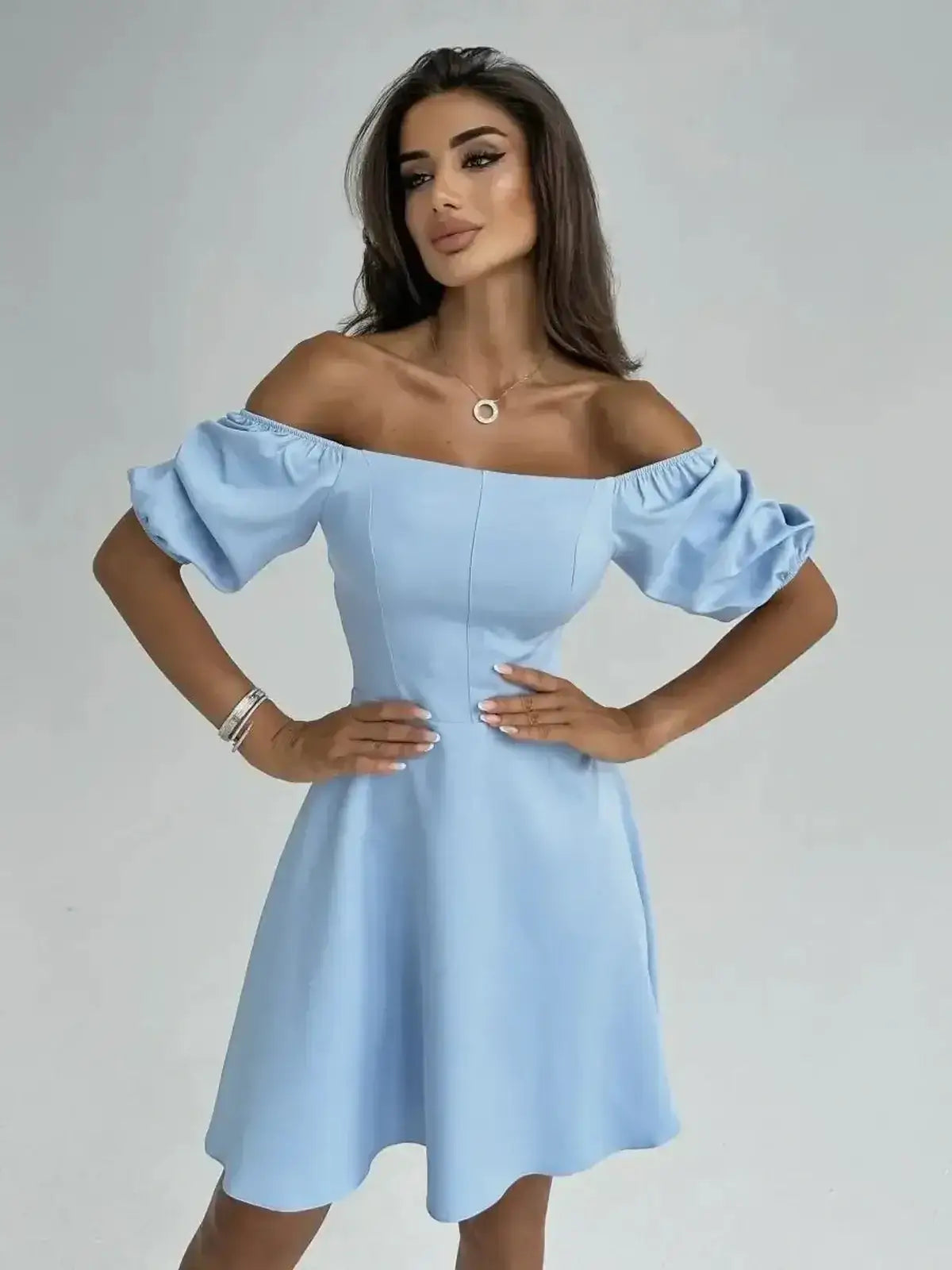 Light blue Celeste Charm Mini Dress with off-shoulder puff sleeves, perfect for summer events and wedding guest attire.