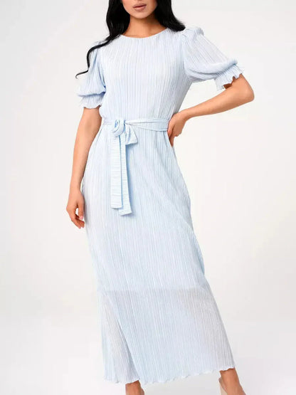 Light blue pleated maxi dress with puff sleeves and a self-tie waist, ideal for summer weddings and formal events.