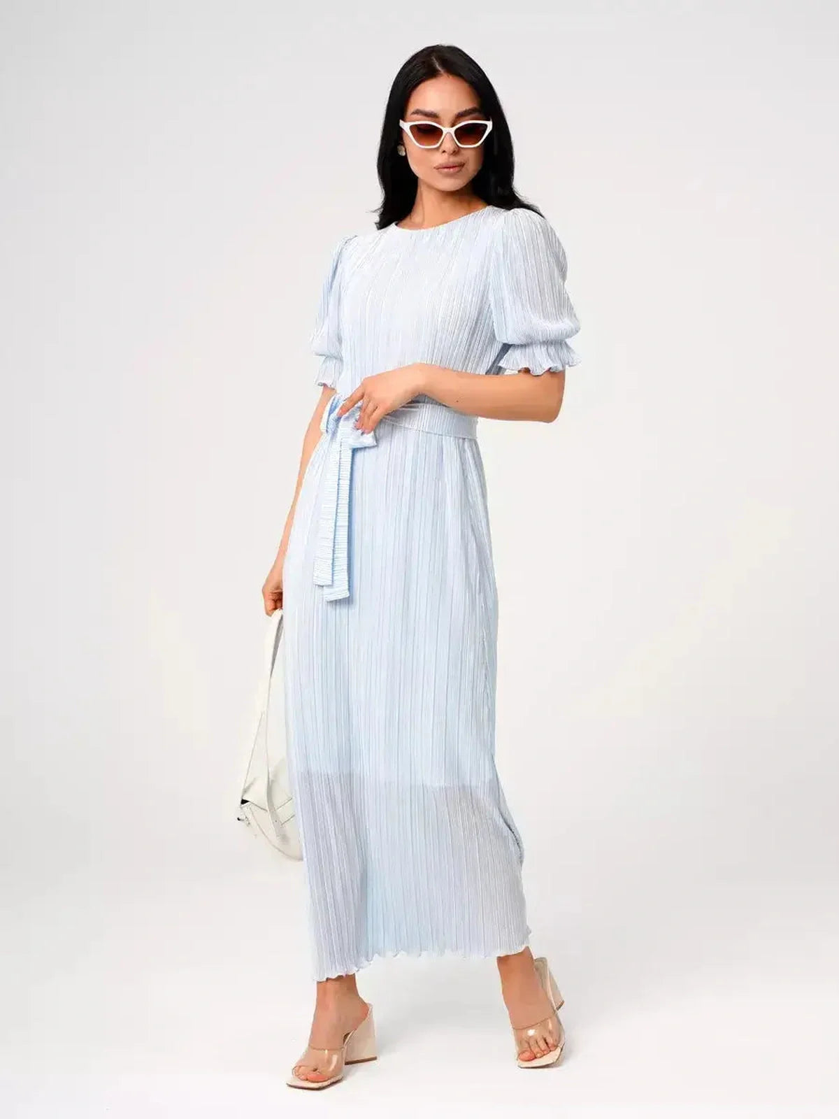 Celeste Flow Maxi Dress in light blue, featuring pleats, puff sleeves, and self-tie waistbelt, ideal for summer occasions.