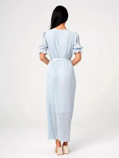 Back view of light blue Celeste Flow Maxi Dress featuring pleats and a self-tie waistbelt, perfect for summer occasions.