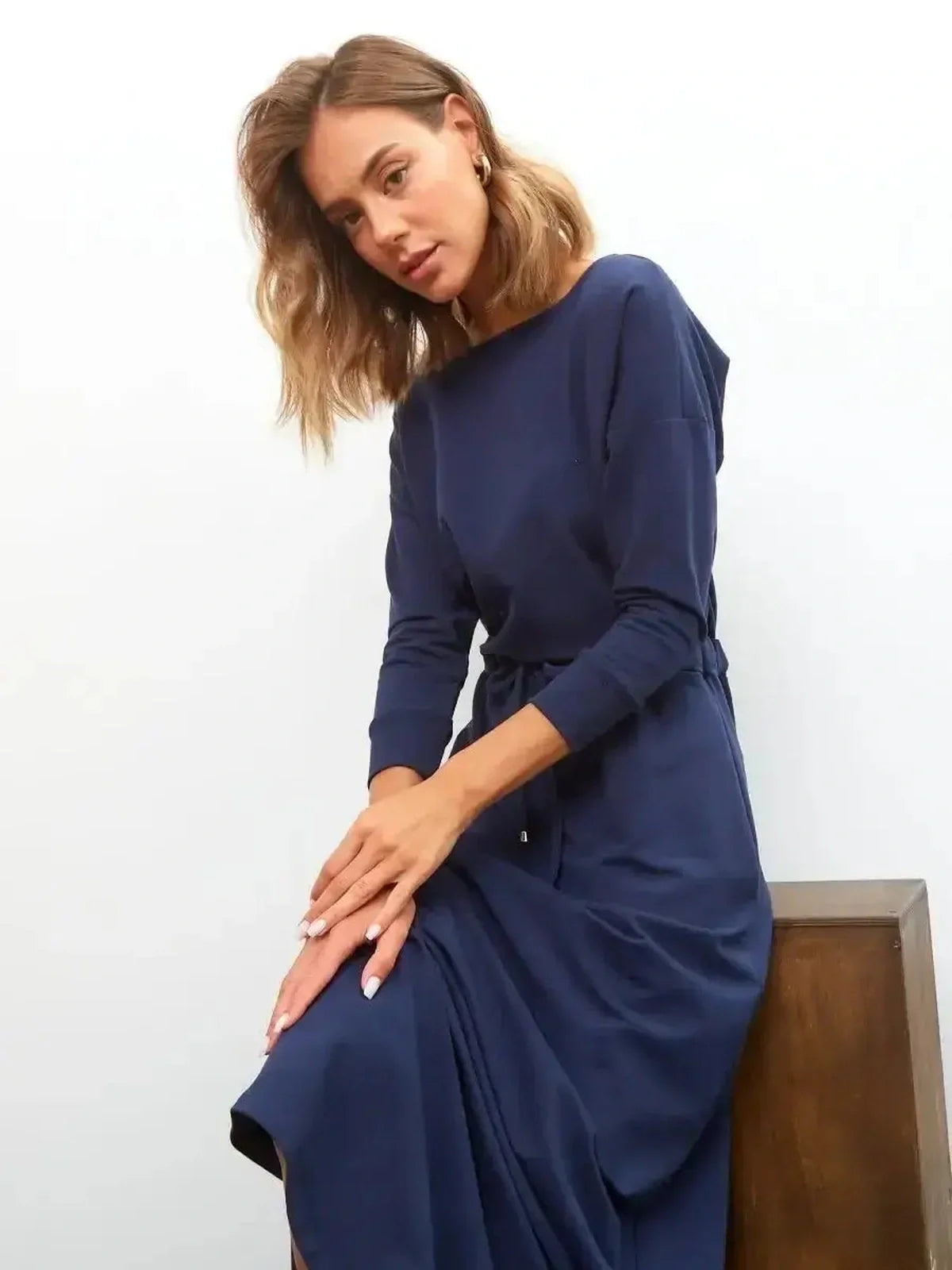 Celeste Maxi Dress in navy with elegant long sleeves, perfect for weddings, graduations, and casual summer occasions.