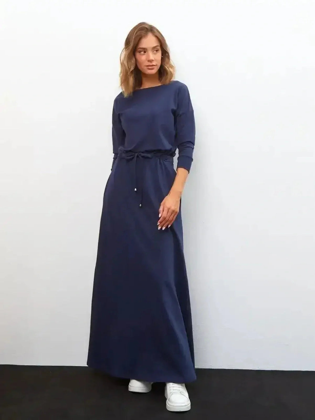 Celeste Maxi Dress in navy with long sleeves and a relaxed fit, perfect for weddings and summer events.