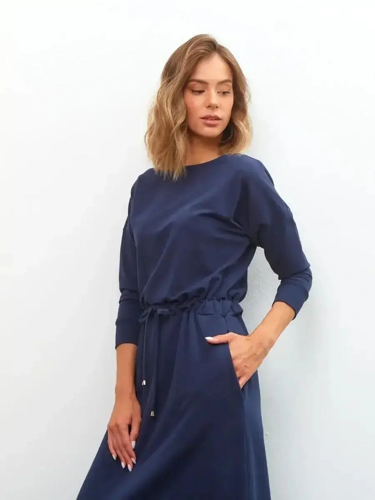 Model wearing the Celeste Maxi Dress in navy, showcasing its elegant style and casual sophistication.