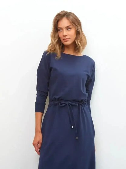 Celeste Maxi Dress in elegant navy with long sleeves, featuring a relaxed fit and drawstring waist for versatile style.