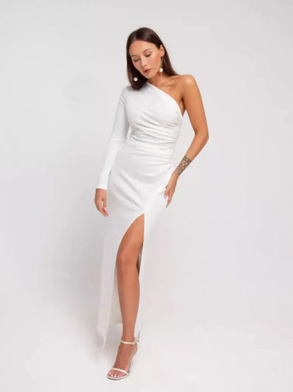Elegant one-shoulder Celeste Maxi Dress in white with draped details and high side slit for formal occasions.
