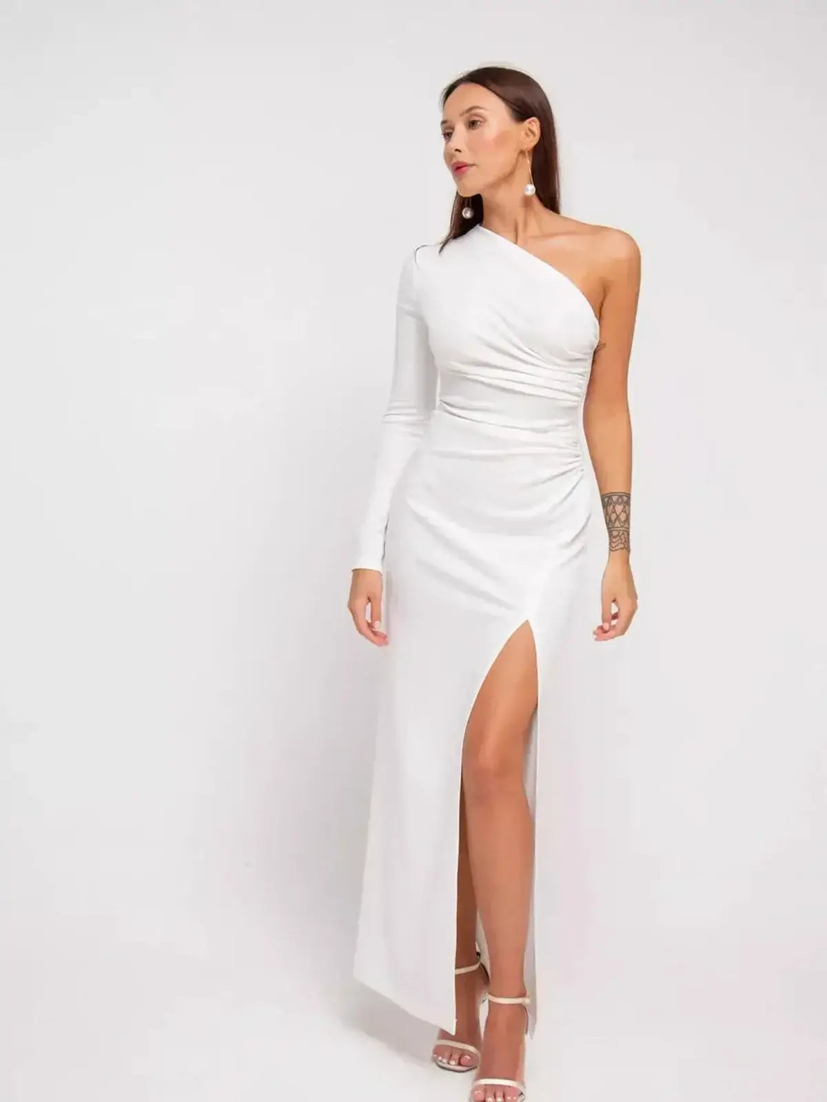 Celeste Maxi Dress featuring a one-shoulder silhouette, draped details, and high side slit, perfect for formal occasions.