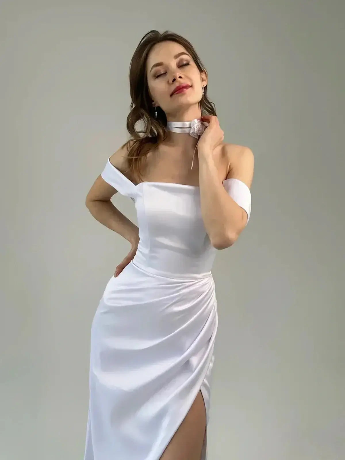Celeste Maxi Dress in white, featuring off-shoulder design, lace-up back, and thigh-high slit for an elegant summer look.