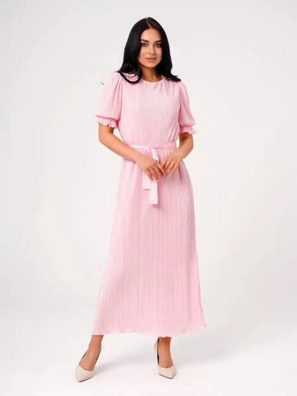 Celeste Maxi Dress in soft pink, featuring pleated design, puff sleeves, and tie waist, perfect for summer events.