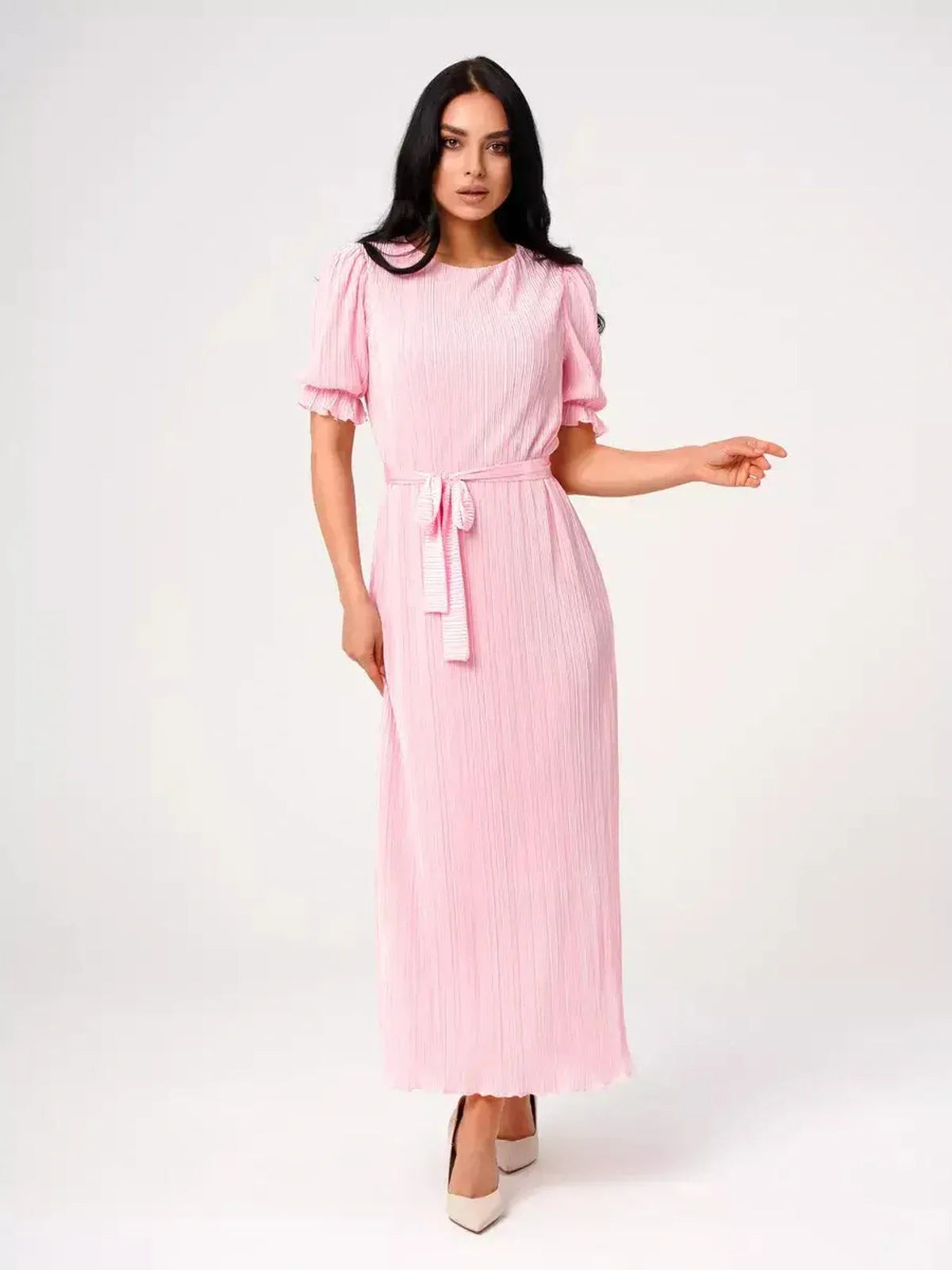 Celeste Maxi Dress in soft pink with pleated design, puff sleeves, and waist tie, perfect for weddings and summer events.
