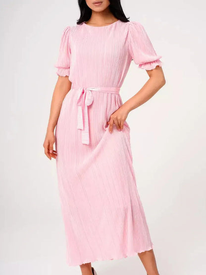 Celeste Maxi Dress in pink with pleats, puff sleeves, and tie waist, ideal for summer events and weddings.