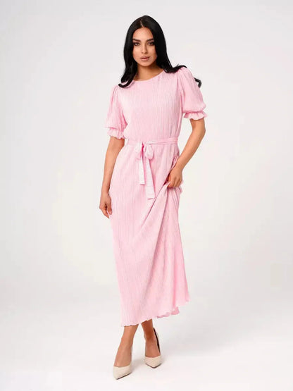 Celeste Maxi Dress in pink, featuring pleated design, puff sleeves, and a tie waist, perfect for summer or wedding events.