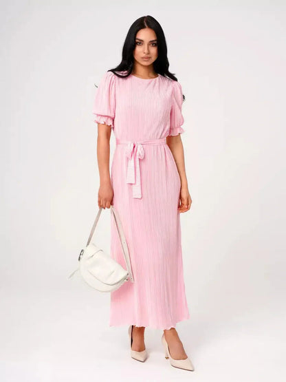 Elegant pink Celeste maxi dress with pleats, puff sleeves, and a tie waist, perfect for summer events or weddings.