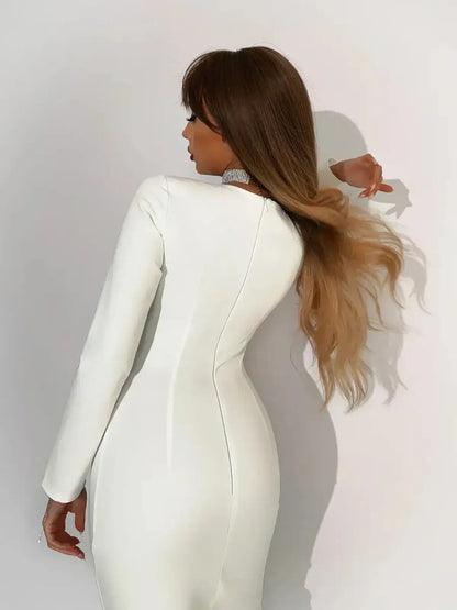 Stylish model showcasing the back view of the Celeste Maxi Dress in creamy-white, featuring a sleek design and flowing hair.