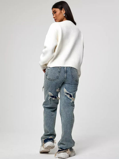 Celeste Pullover by Lauven, oversized cropped women's sweater in soft ivory paired with ripped jeans.