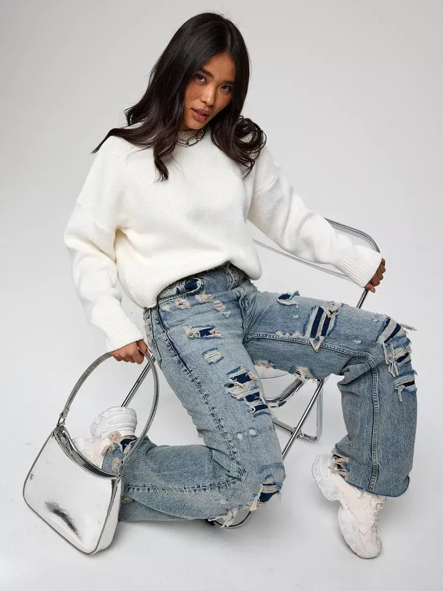 Celeste Pullover by Lauven: Oversized cropped women's sweater in soft ivory, styled with distressed jeans.