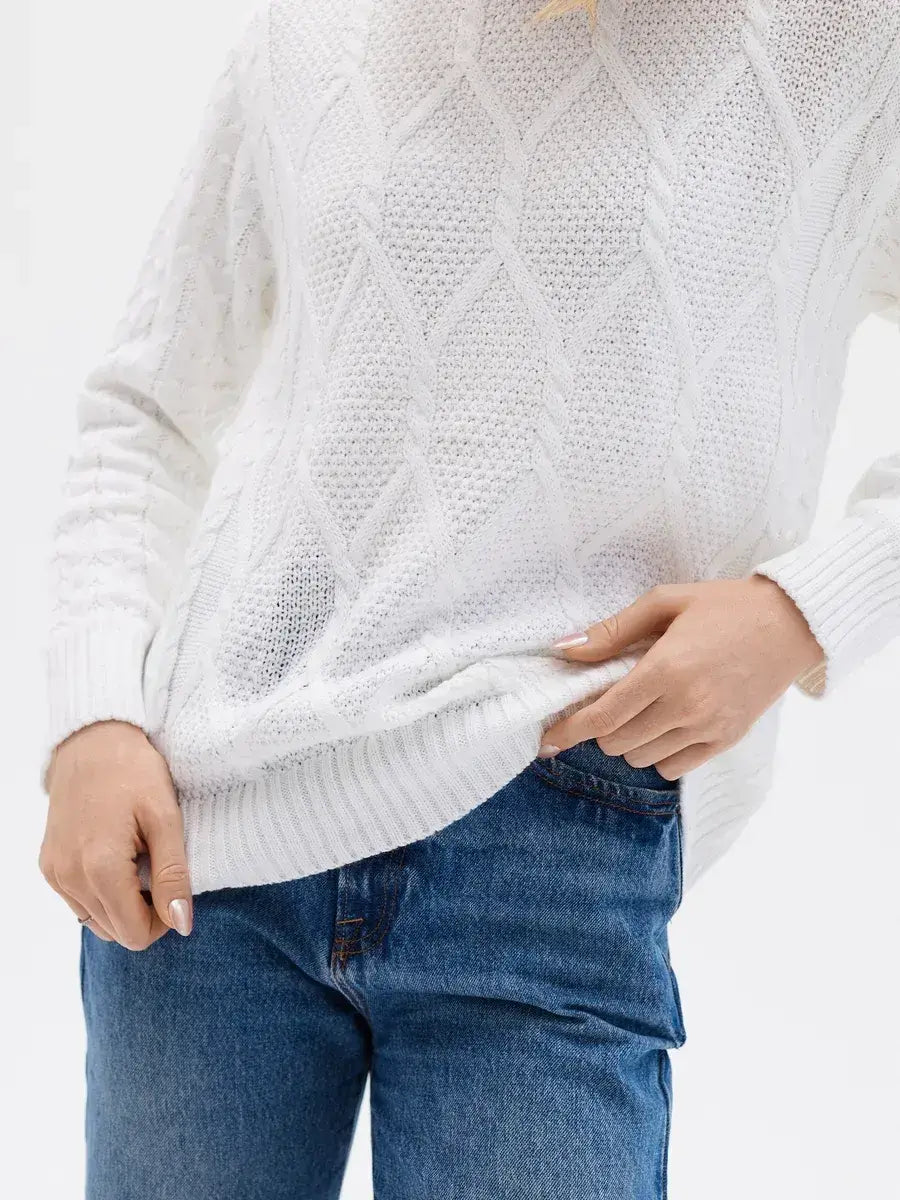 Celeste Sweater by Lauven, elegant white knitwear featuring patterned sleeves and a stylish cable knit design.