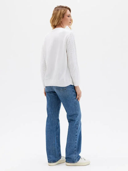 Celeste Sweater by Lauven, elegant white knitwear with patterned sleeves, perfect for cooler seasons.