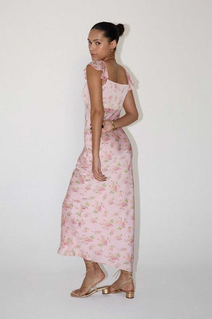 Celeste Women's Dress featuring pink floral patterns, flutter sleeves, and a flowing silhouette, perfect for summer and wedding guests.
