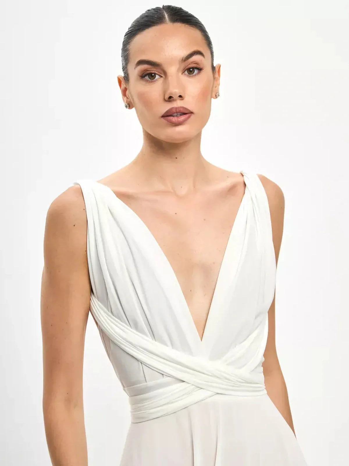 Model showcasing the Celeste Wrap Maxi Dress with a draped V-neckline and convertible waist tie detail.